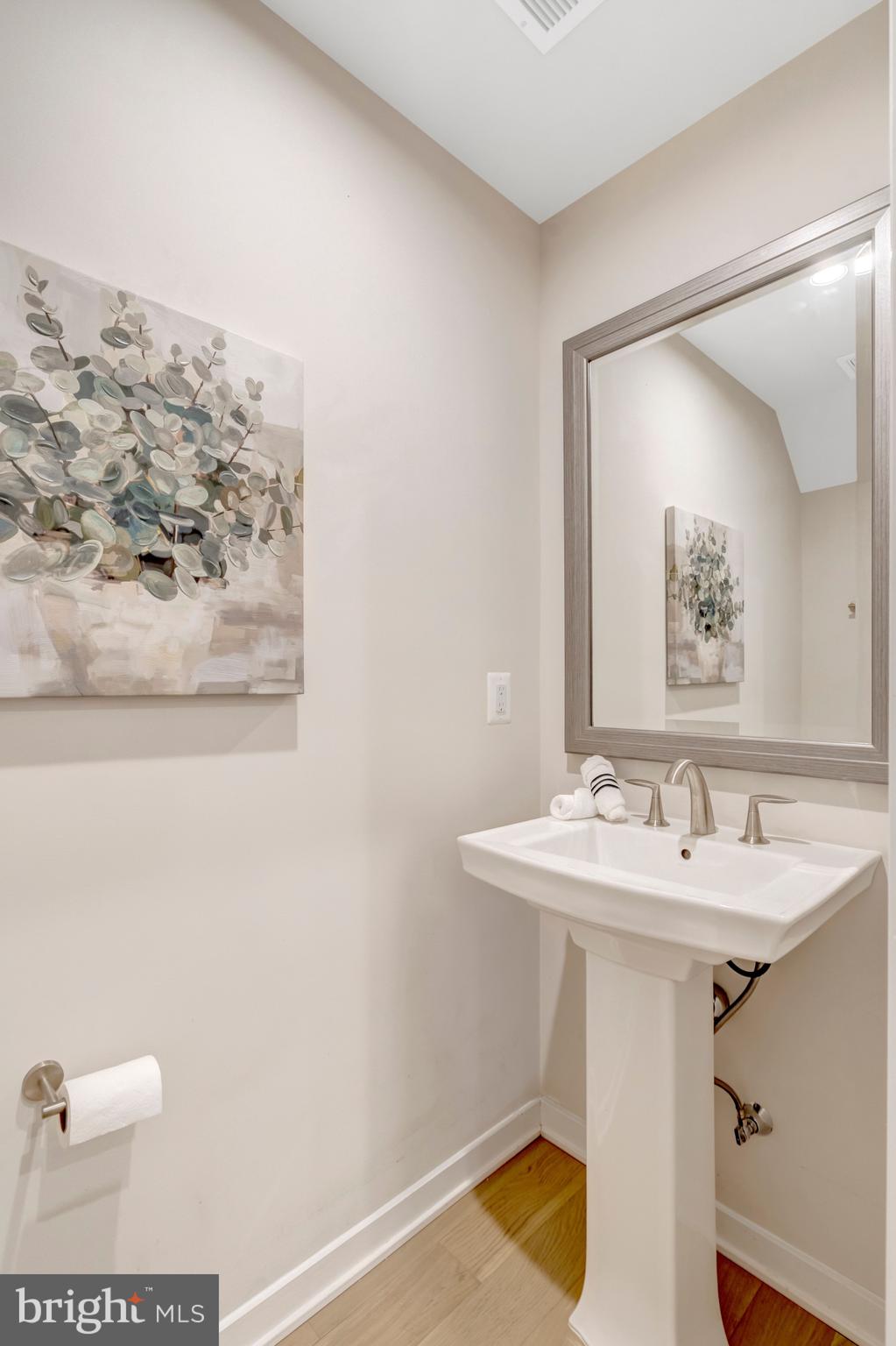 22379 Roanoke Rise Terrace Ashburn, VA 20148 - Photo 11 of 40 a bathroom with a sink mirror and vanity