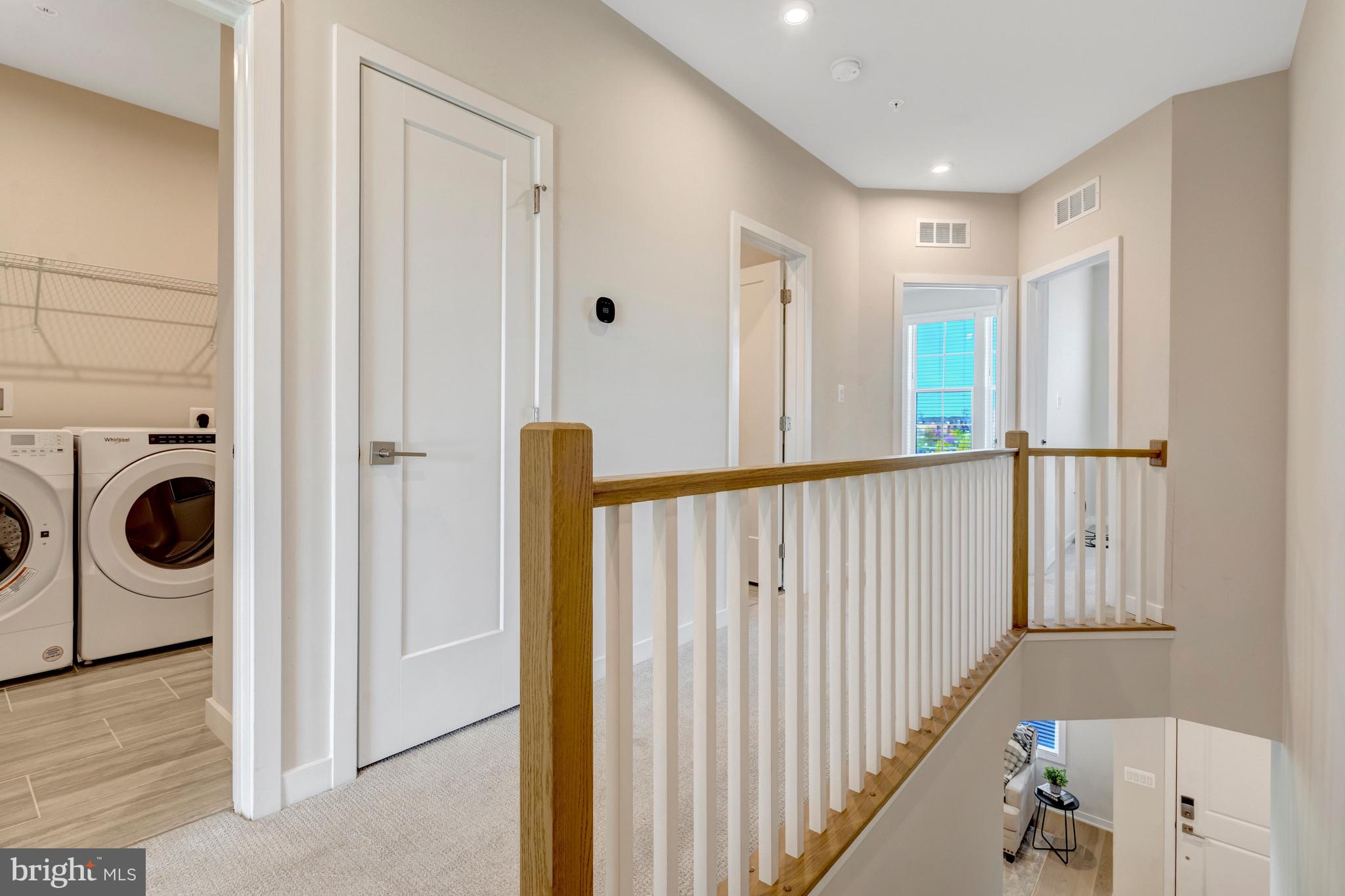 22379 Roanoke Rise Terrace Ashburn, VA 20148 - Photo 14 of 40 a view of a hallway and a washer and dryer