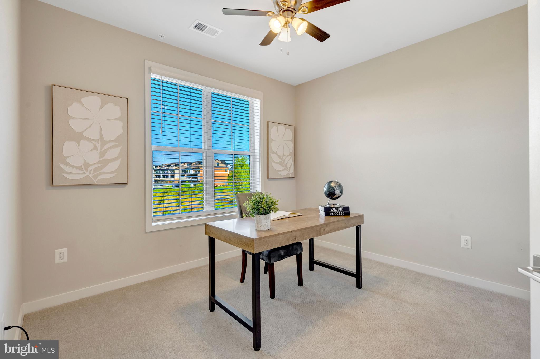 22379 Roanoke Rise Terrace Ashburn, VA 20148 - Photo 16 of 40 a view of a workspace with furniture and a window