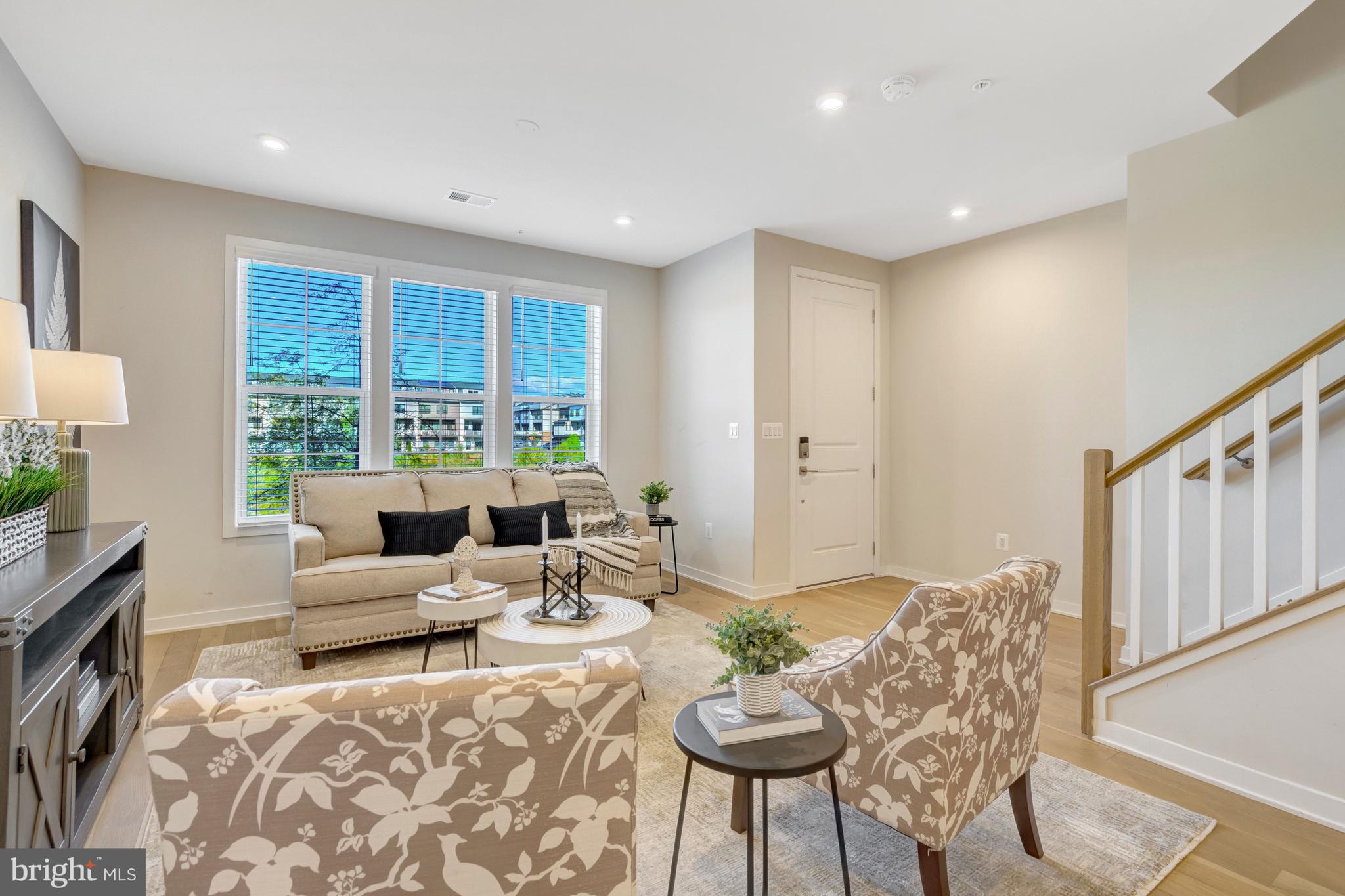 22379 Roanoke Rise Terrace Ashburn, VA 20148 - Photo 3 of 40 a living room with furniture and a large window