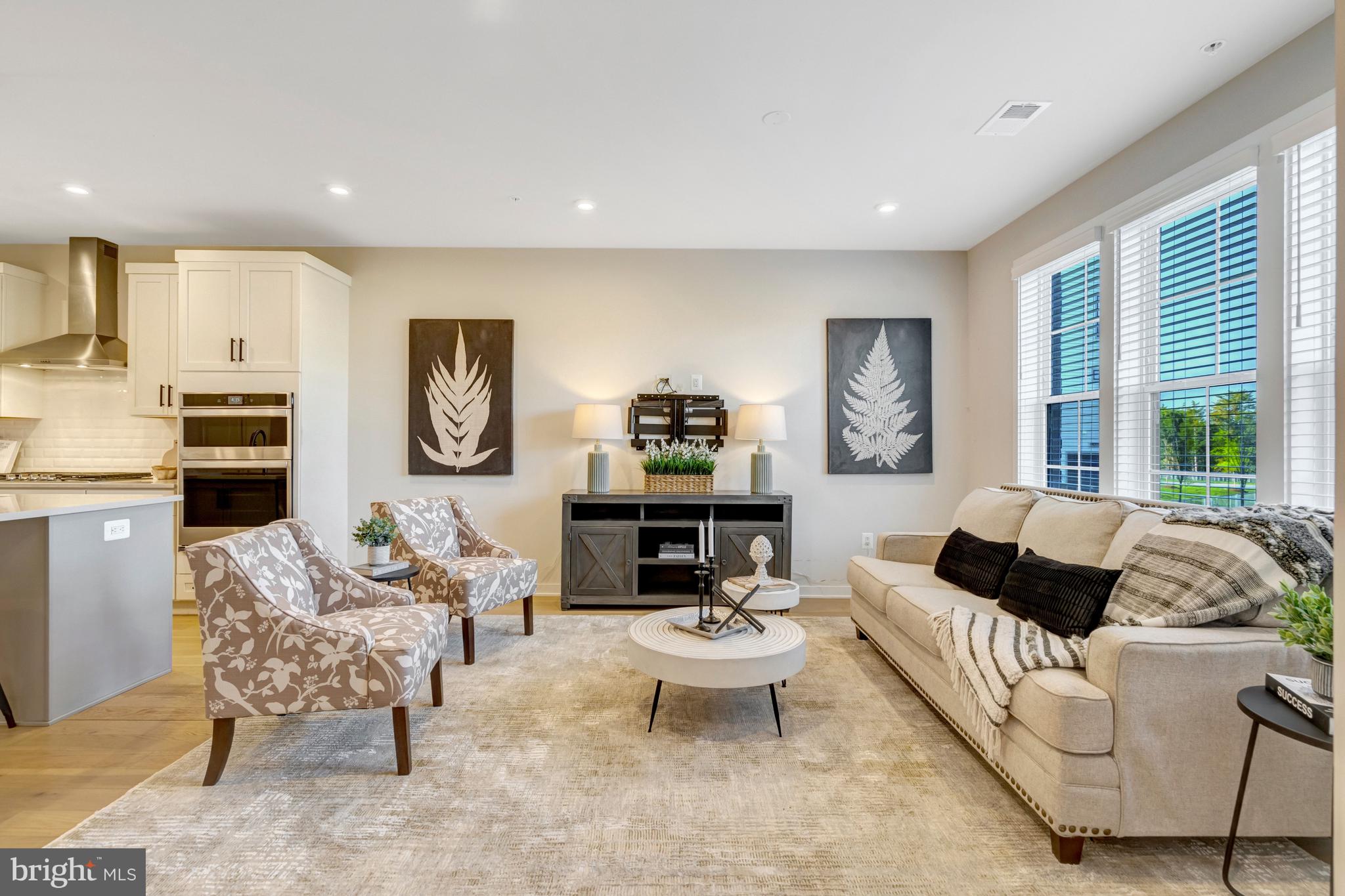 22379 Roanoke Rise Terrace Ashburn, VA 20148 - Photo 4 of 40 a living room with furniture and a large window