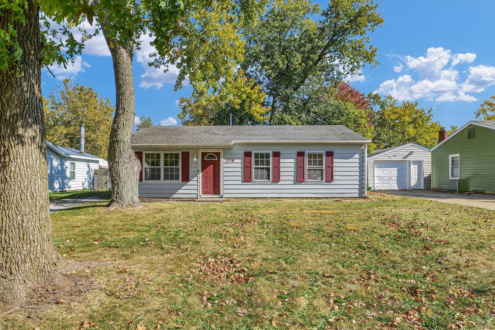 1710 Parkside Terrace Champaign, IL 61821 - Photo 1 of 31 a front view of a house with a garden