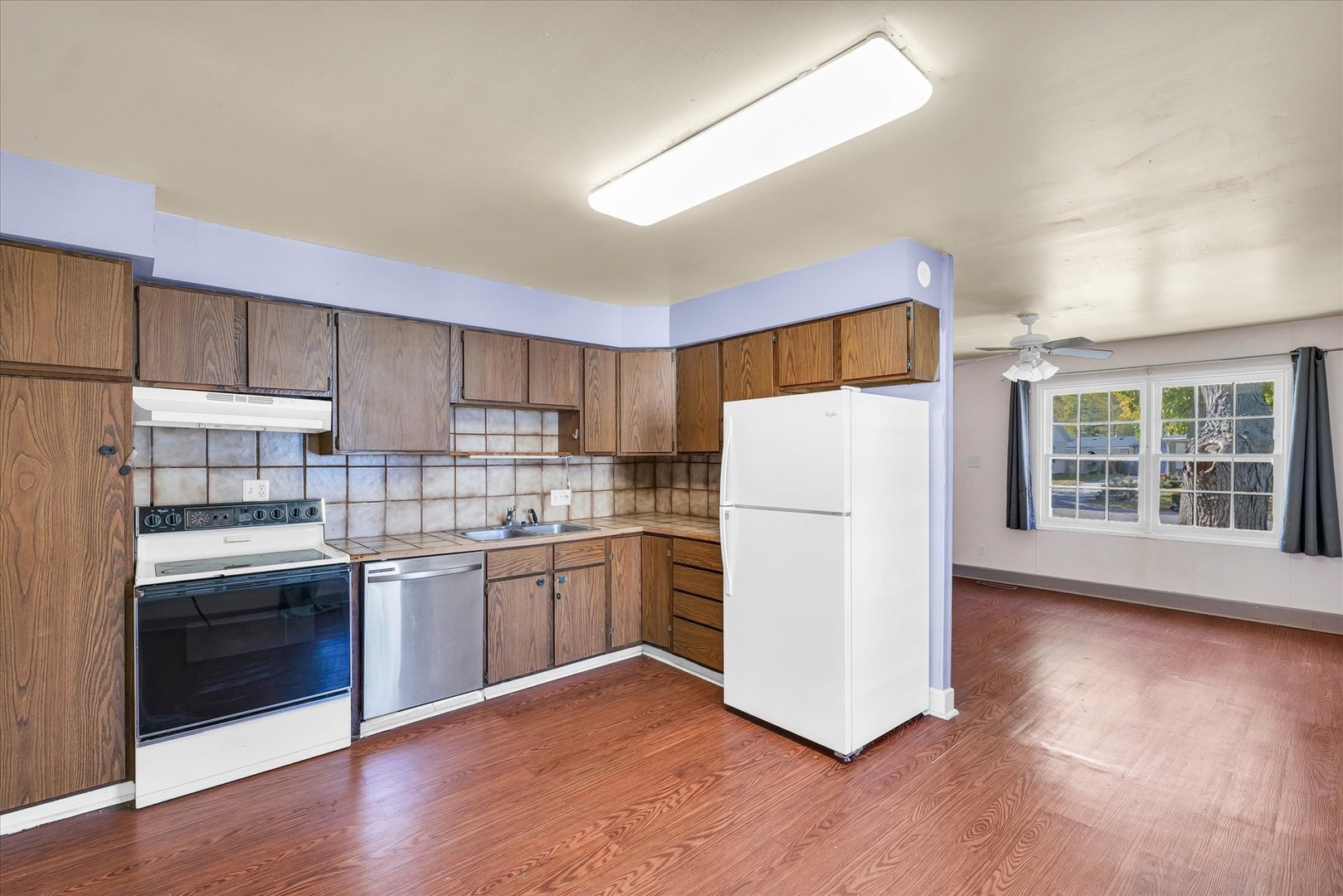 1710 Parkside Terrace Champaign, IL 61821 - Photo 11 of 31 a kitchen with stainless steel appliances granite countertop a refrigerator and a stove top oven