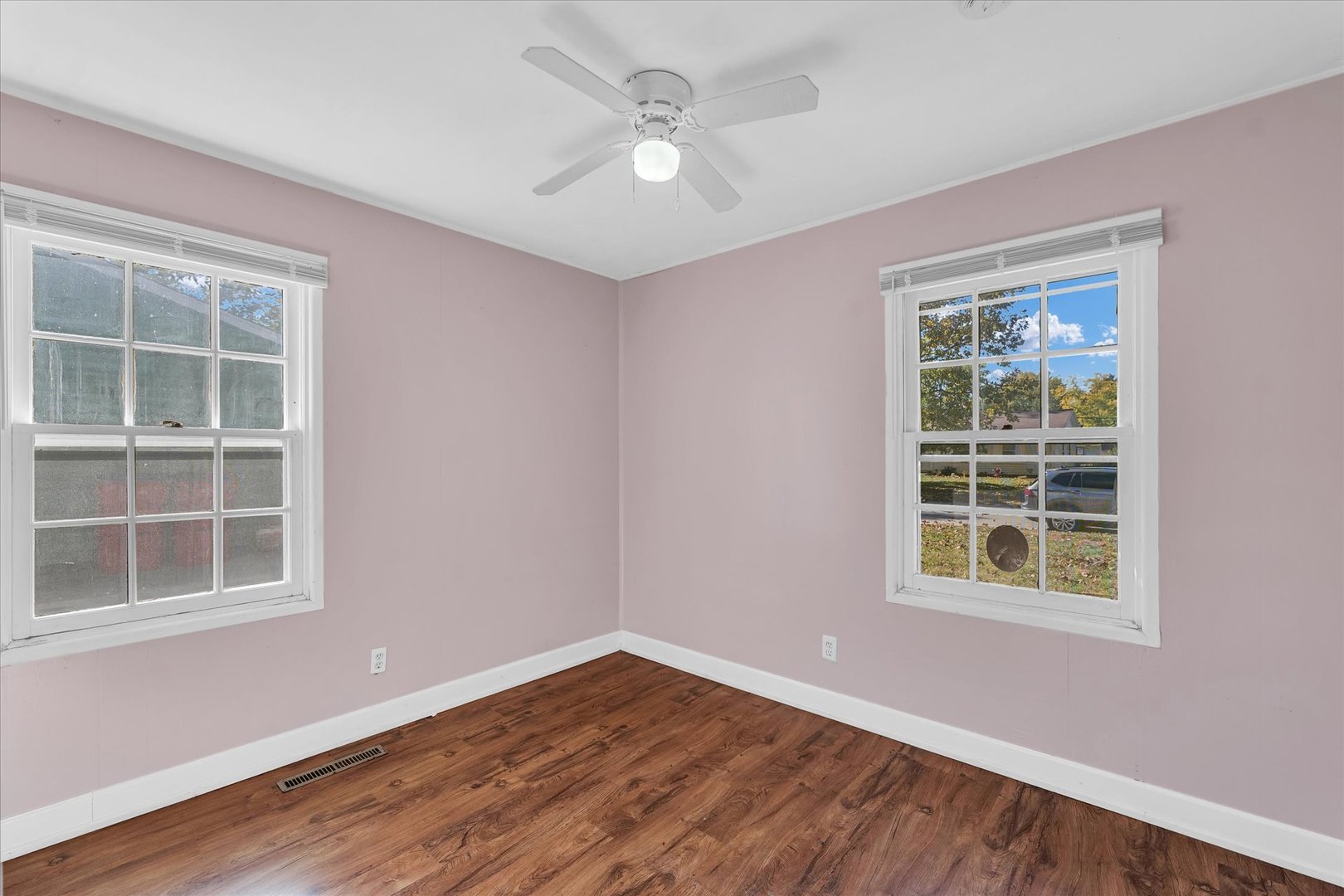 1710 Parkside Terrace Champaign, IL 61821 - Photo 17 of 31 a view of an empty room with a window and wooden floor