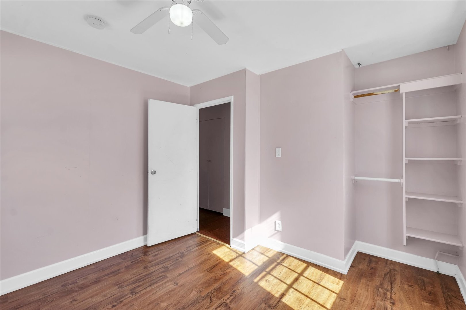 1710 Parkside Terrace Champaign, IL 61821 - Photo 18 of 31 an empty room with wooden floor closet and windows