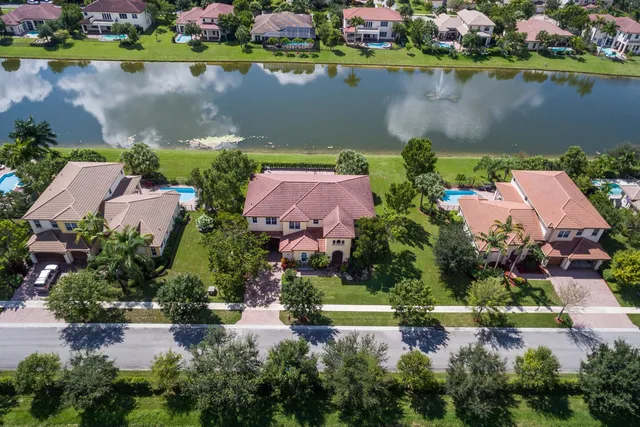 an aerial view of a house with a lake view