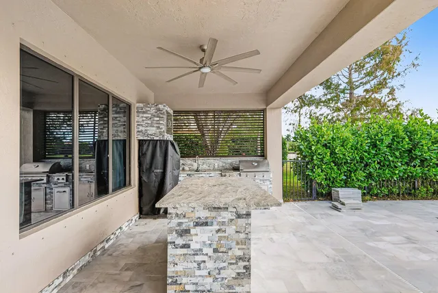 a kitchen with a stove a sink and a refrigerator