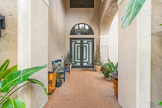 a view of entryway and hall with dining room