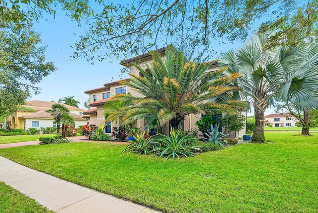 a view of staircase with railing and a chandelier