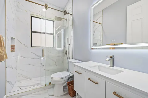 a view of an empty room with floor to ceiling windows