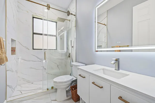 a view of an empty room with floor to ceiling windows