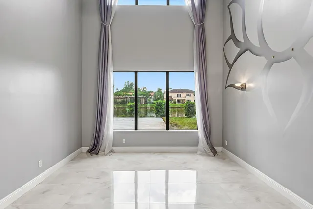 a view of a livingroom with a large window and table