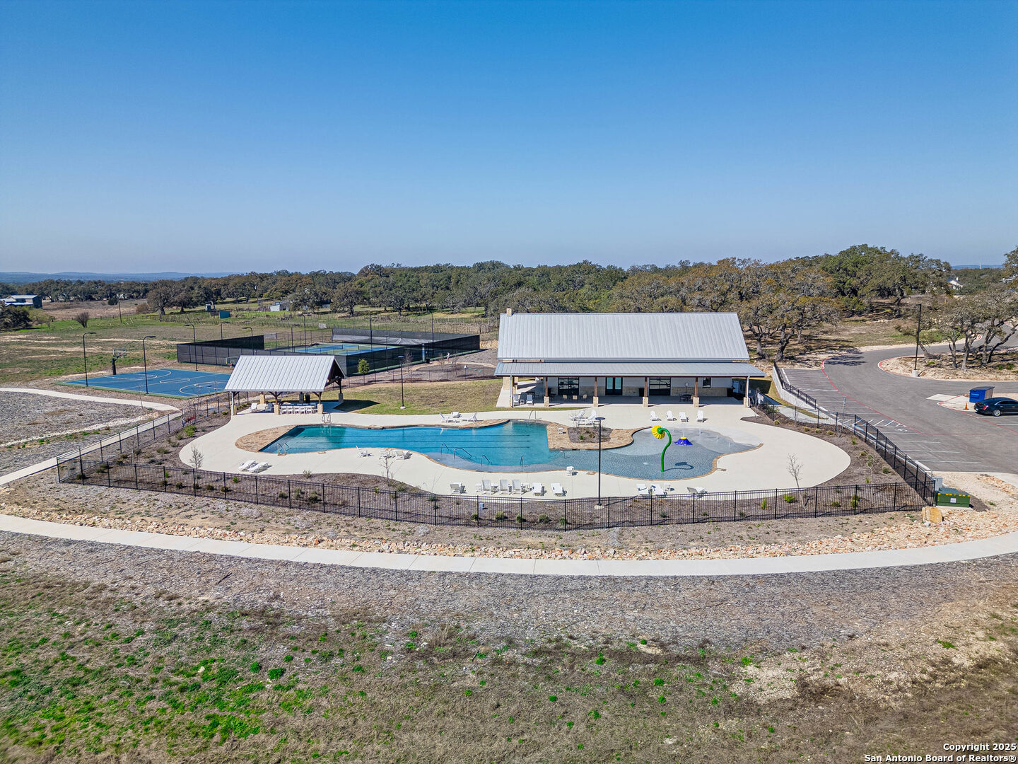 528 Rosemary Rdg Drive Bulverde, TX 78163 - Photo 11 of 44 a view of a swimming pool with a lake view