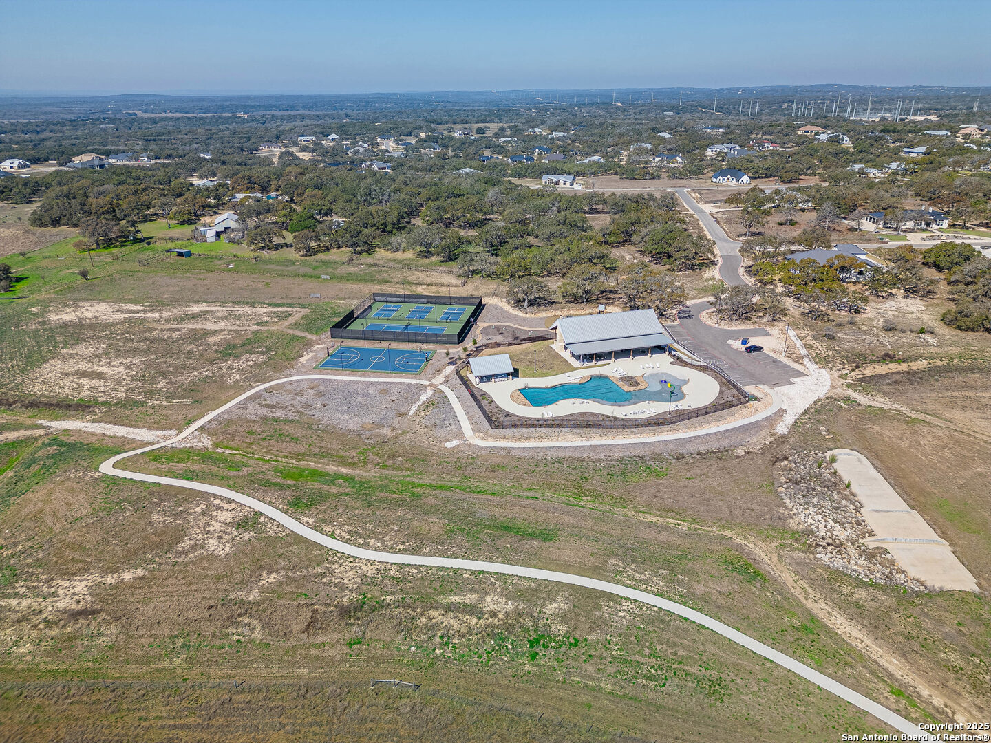 528 Rosemary Rdg Drive Bulverde, TX 78163 - Photo 13 of 44 a view of a lake with a mountain