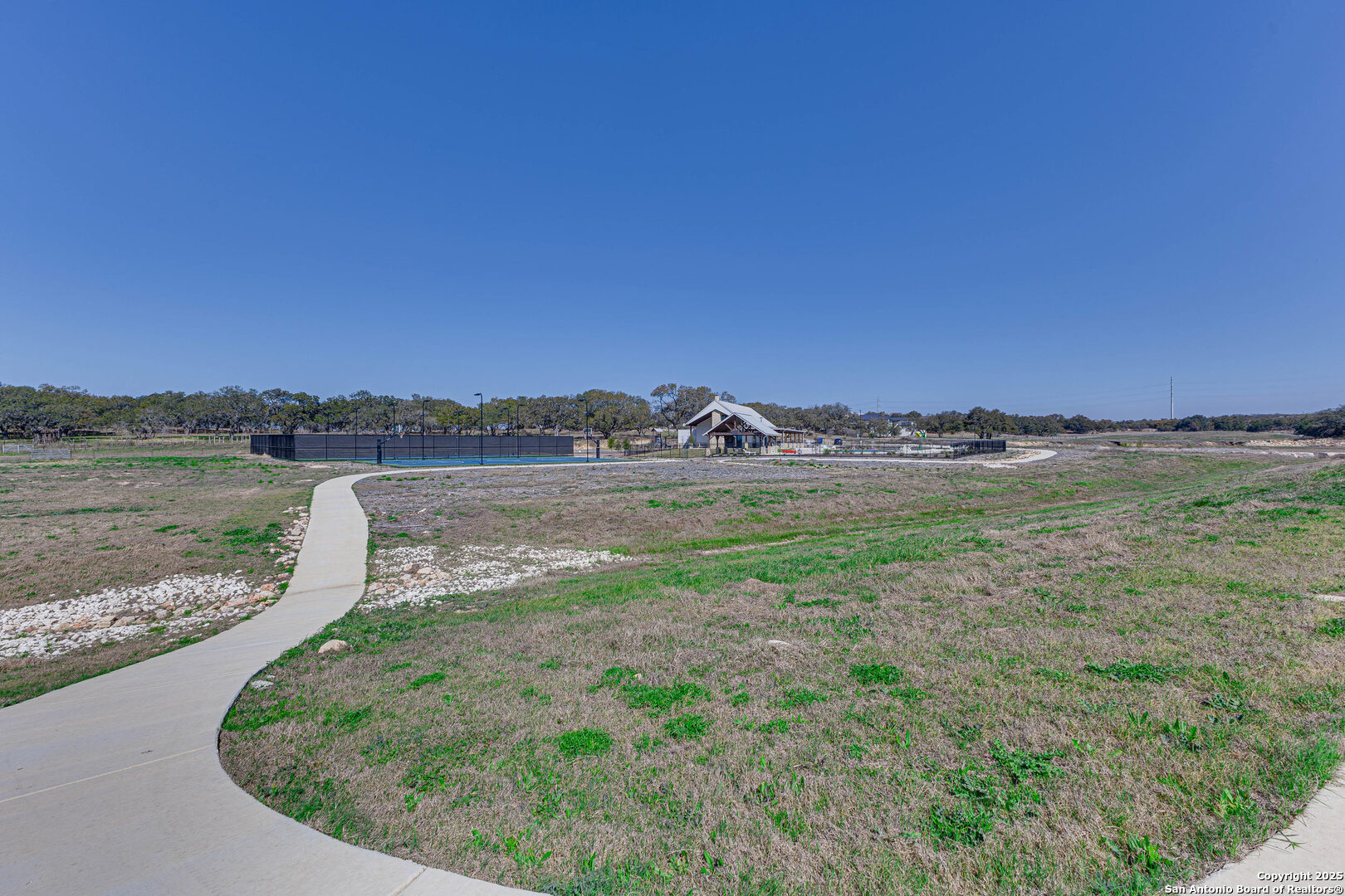 528 Rosemary Rdg Drive Bulverde, TX 78163 - Photo 43 of 44 a view of a lake with houses in the back