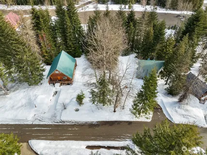 an aerial view of a house with outdoor space