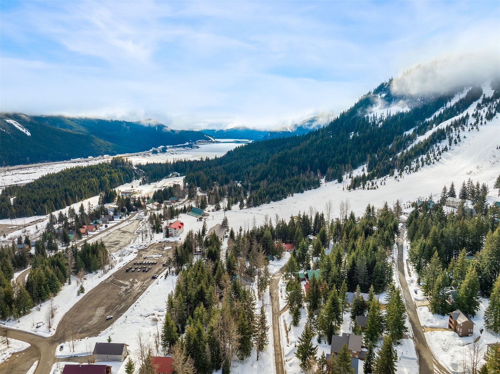 22 Chamonix Place Snoqualmie Pass, WA 98068 - Photo 6 of 9 a view of a lake with a city