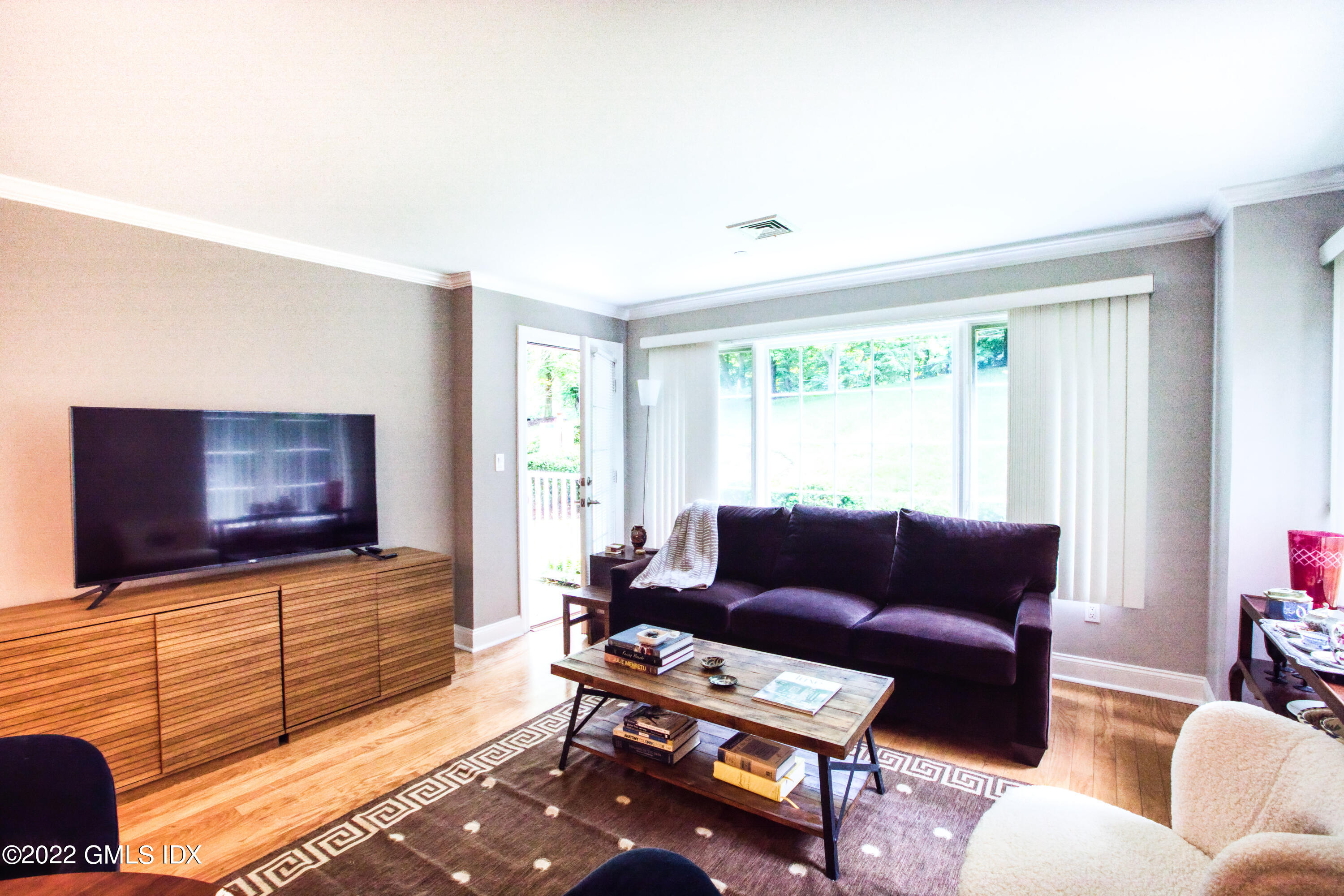 2 Homestead Lane, Unit 106 Greenwich, CT 06831 - Photo 11 of 25 a living room with furniture and a flat screen tv
