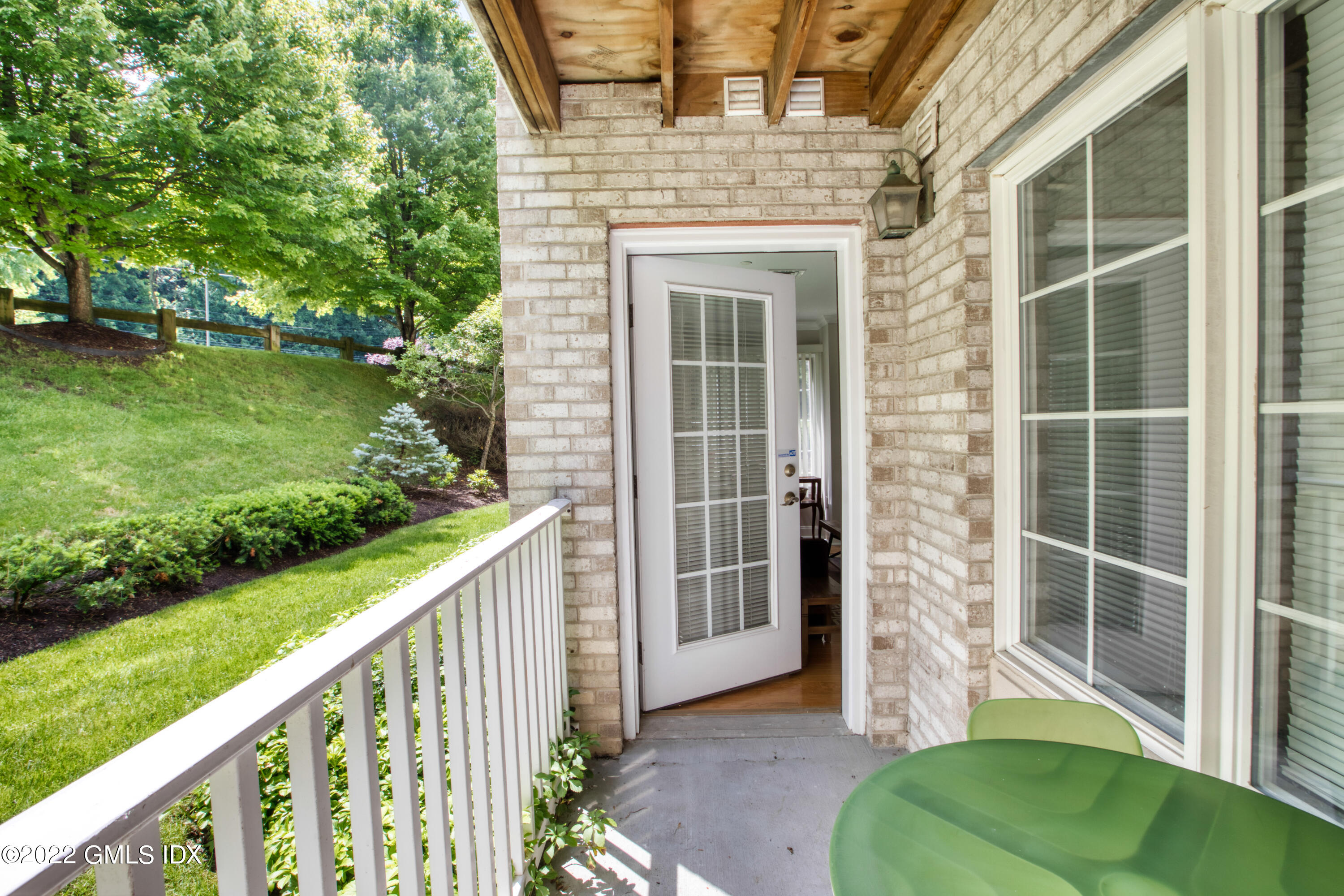 2 Homestead Lane, Unit 106 Greenwich, CT 06831 - Photo 19 of 25 a view of a house with backyard from a balcony