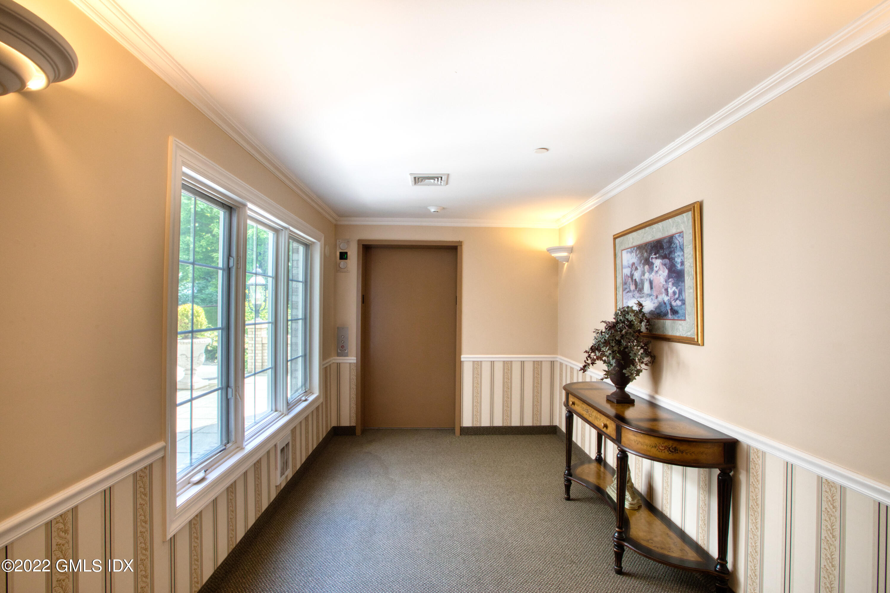 2 Homestead Lane, Unit 106 Greenwich, CT 06831 - Photo 24 of 25 a view of an empty room with a window