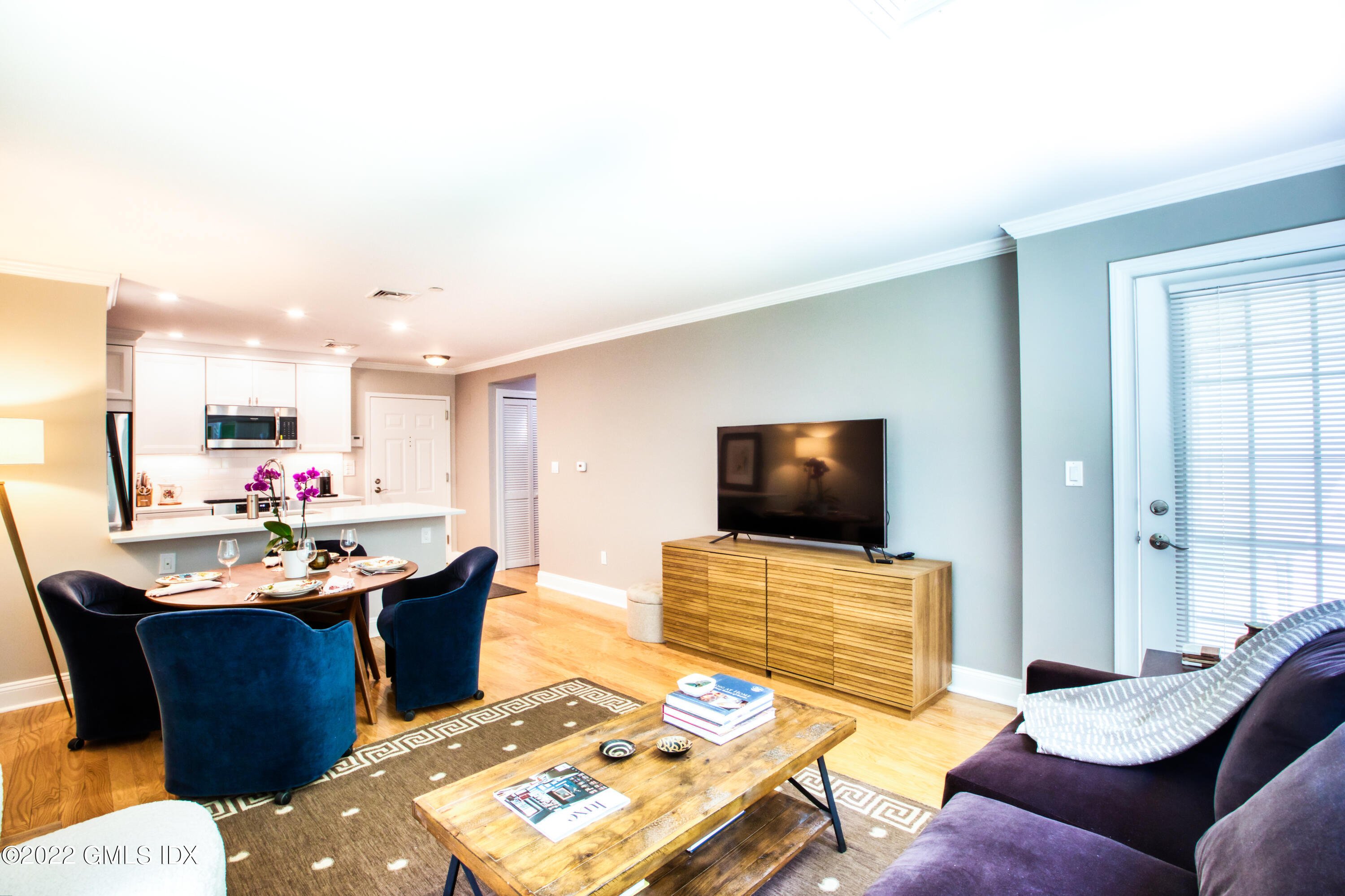 2 Homestead Lane, Unit 106 Greenwich, CT 06831 - Photo 8 of 25 a living room with furniture and a flat screen tv