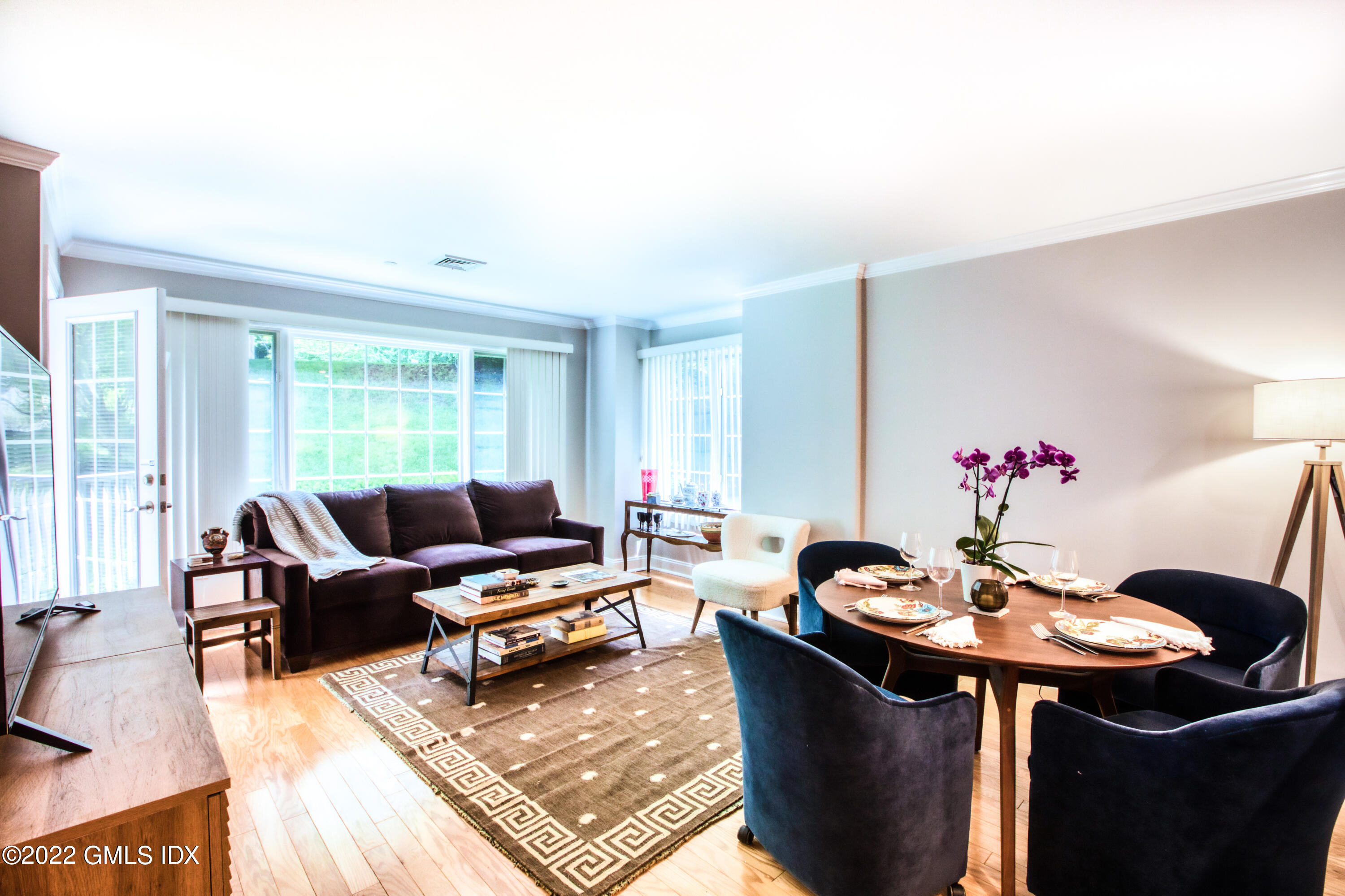 2 Homestead Lane, Unit 106 Greenwich, CT 06831 - Photo 9 of 25 a living room with furniture and a window