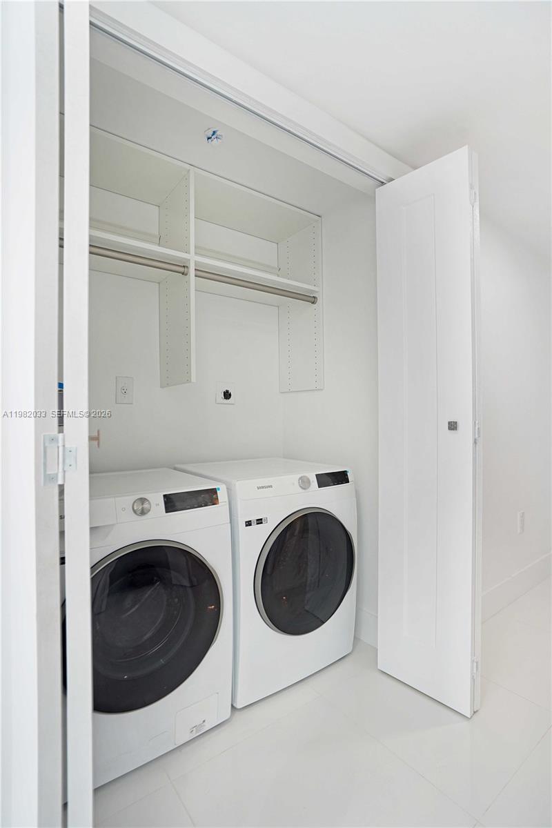 90 Alton Road, Unit 2212 Miami Beach, FL 33139 - Photo 12 of 42 Hallway closet, brand new washer and dryer