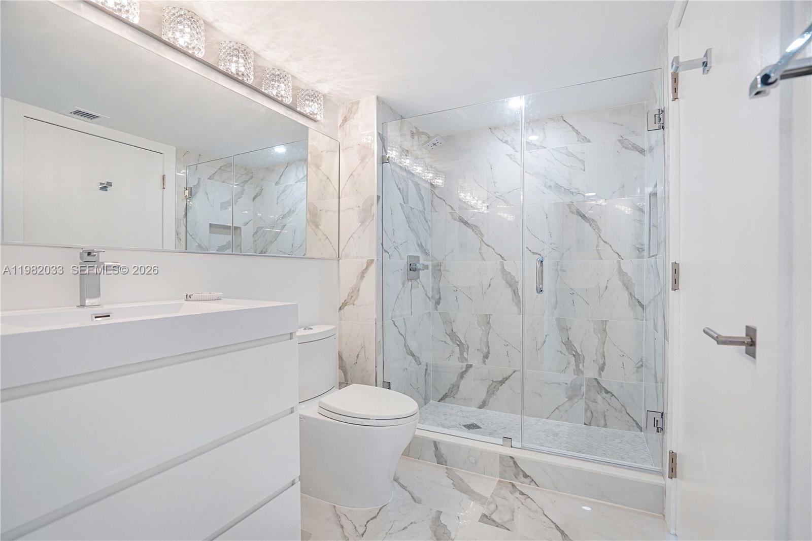 90 Alton Road, Unit 2212 Miami Beach, FL 33139 - Photo 21 of 42 Guest Bathroom shower