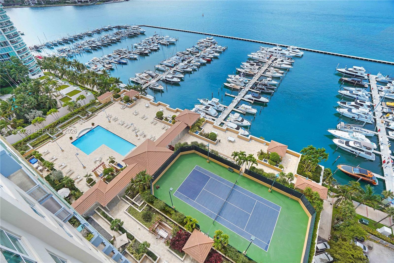 90 Alton Road, Unit 2212 Miami Beach, FL 33139 - Photo 34 of 42 Pool and Tennis Courts viewed from balcony