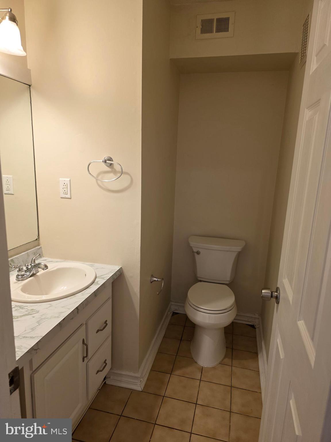 9 Georgetown Road Lindenwold, NJ 08021 - Photo 7 of 14 a bathroom with a granite countertop toilet and a sink