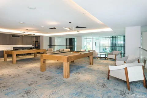 a view of a living room and kitchen