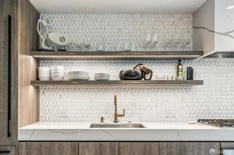 a view of kitchen with cabinets and wooden floor