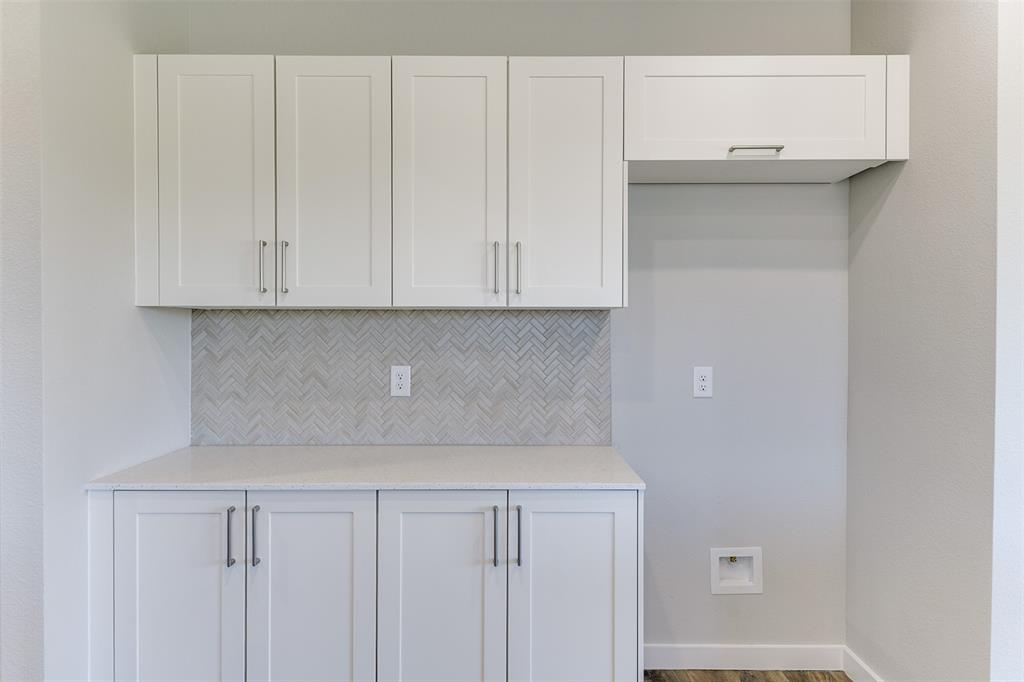 4240 Clovis Street Midlothian, TX 76065 - Photo 12 of 19 a view of cabinets and wooden floor