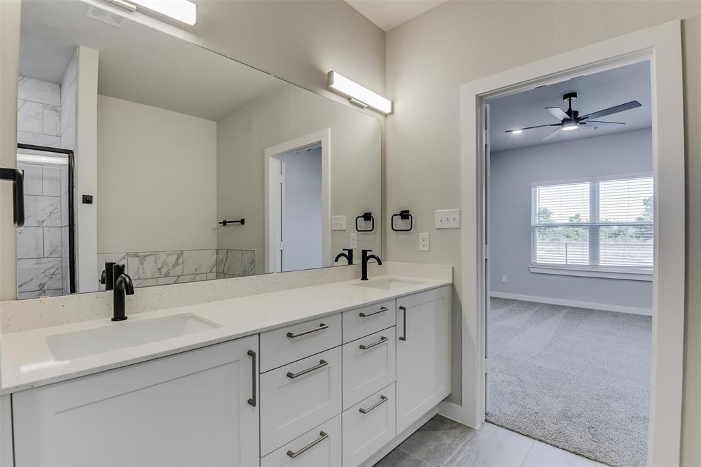4240 Clovis Street Midlothian, TX 76065 - Photo 16 of 19 a bathroom with a double vanity sink and mirror