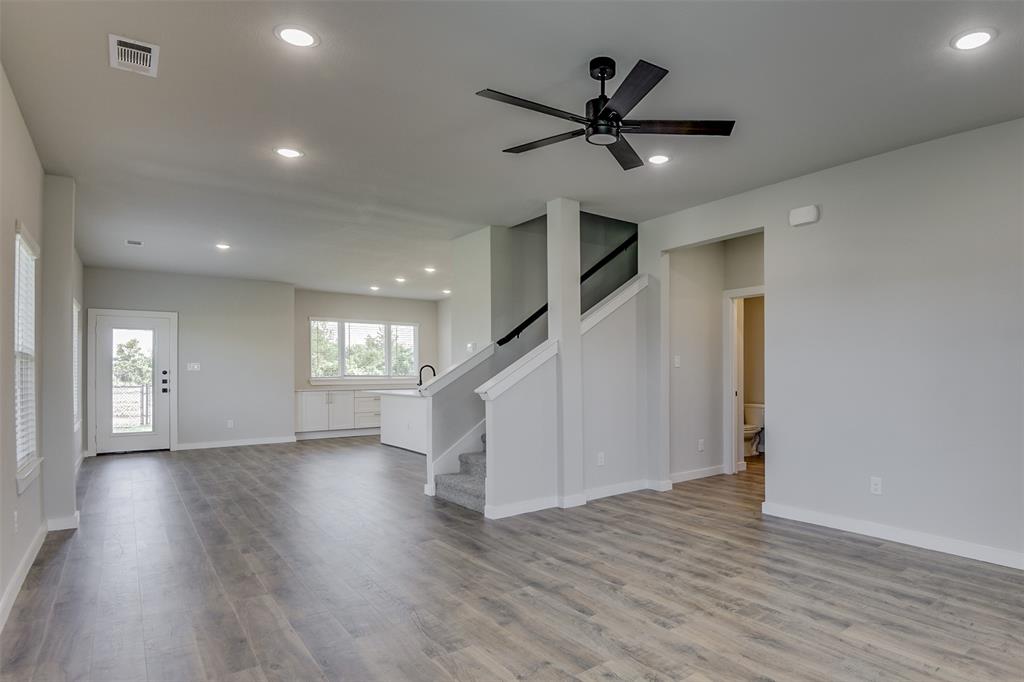 4240 Clovis Street Midlothian, TX 76065 - Photo 2 of 19 a view of a livingroom with a hardwood floor and ceiling fan