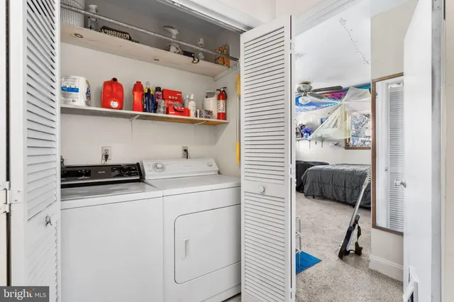 a bathroom with a sink toilet and a mirror