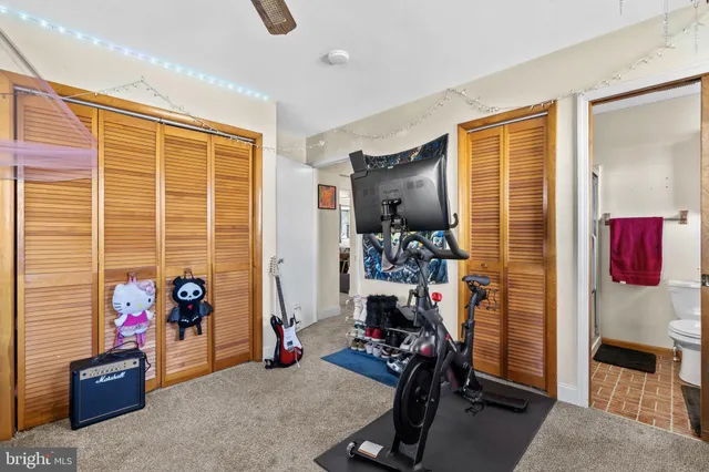 a bedroom with a bed and a closet