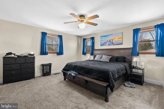 a bathroom with a sink toilet and a mirror