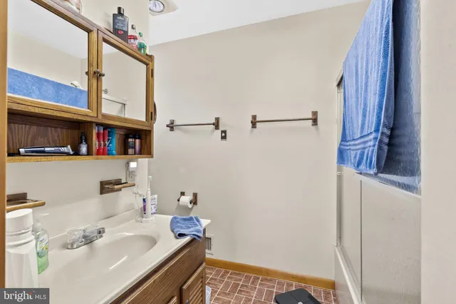 a view of a balcony with wooden fence and floor