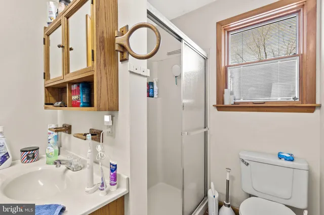 a view of a garage with a bike and car