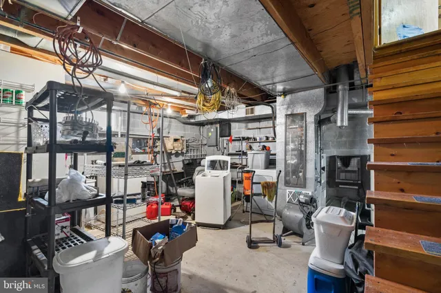 a front view of house with yard and trees around