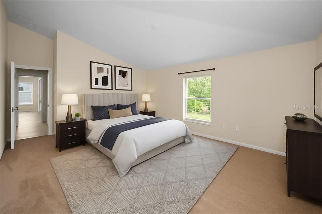 10106 Tolman Drive Hudson, FL 34667 - Photo 20 of 66 a bedroom with a bed and a tv