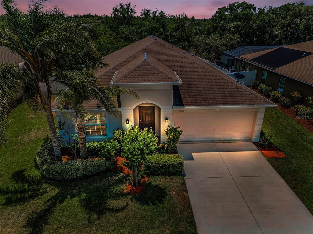 10106 Tolman Drive Hudson, FL 34667 - Photo 64 of 66 a front view of a house with a yard