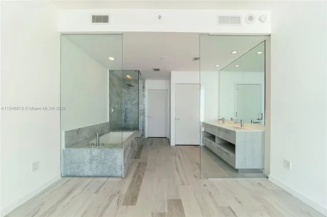 a living room with furniture large window and outdoor view