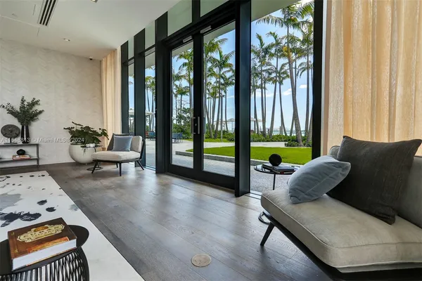 a view of living room with furniture and floor to ceiling window