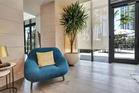 a view of a backyard with a patio and swimming pool