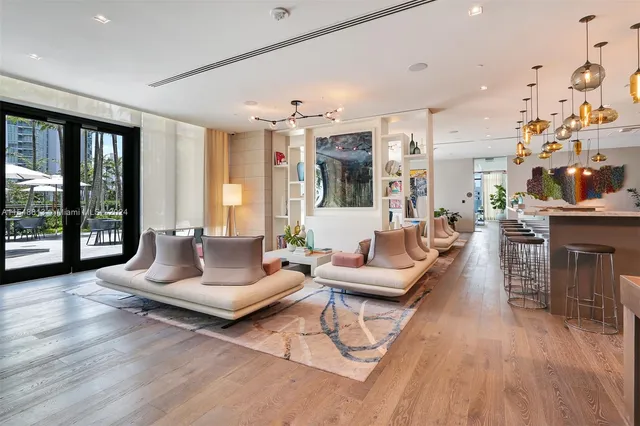 a view of a patio with couches table and chairs potted plants