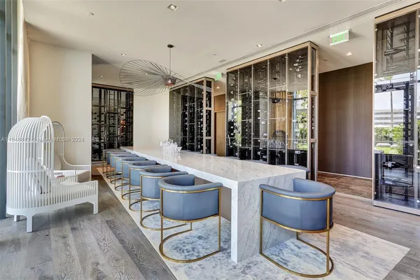 a living room with furniture and a glass table