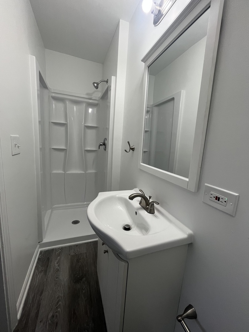 46 North 46th Road Mendota, IL 61342 - Photo 13 of 48 a bathroom with a sink a toilet and shower