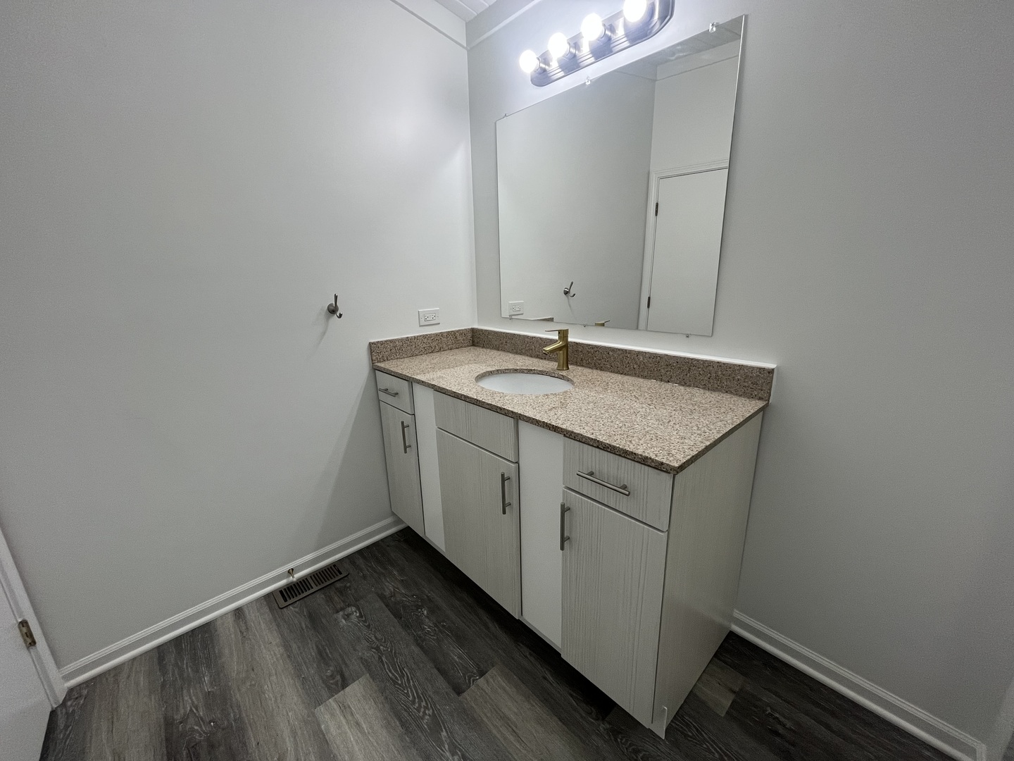 46 North 46th Road Mendota, IL 61342 - Photo 24 of 48 a bathroom with a granite countertop sink and a mirror